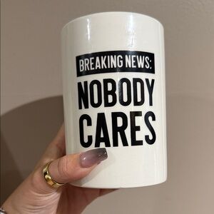 White ceramic makeup brush holder with Bold Black Text